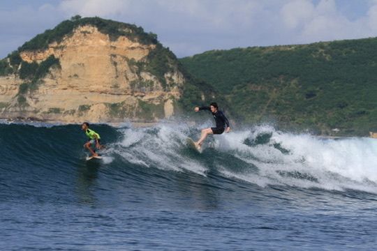 Tom riding a clean wave.